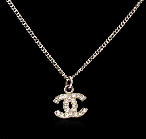 chanel logo necklace fake|how to authenticate chanel earrings.